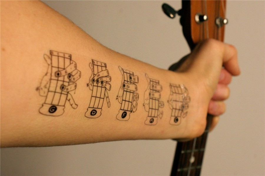 24 Useful Tattoos That Have A Practical Application. Ukulele