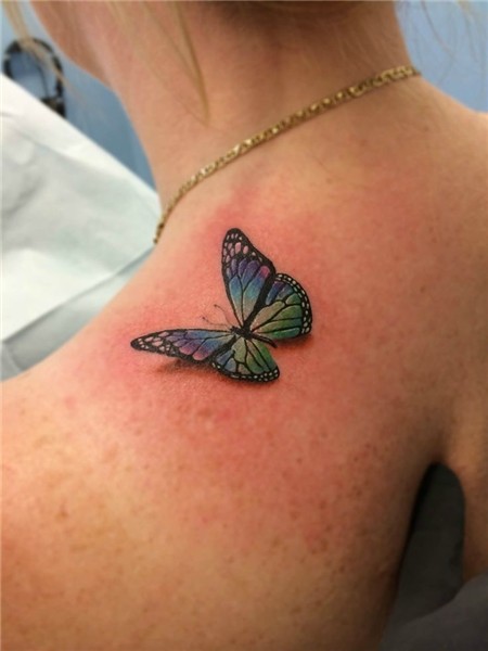 3-D butterfly on shoulder tattooed by Chris Burke at Serenit