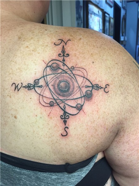 Adorable atom tattoo, with a compass