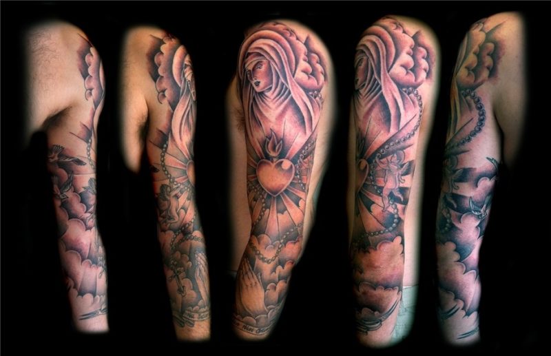 Art Clouds Tattoo Design on Arm for Men - TattooMagz