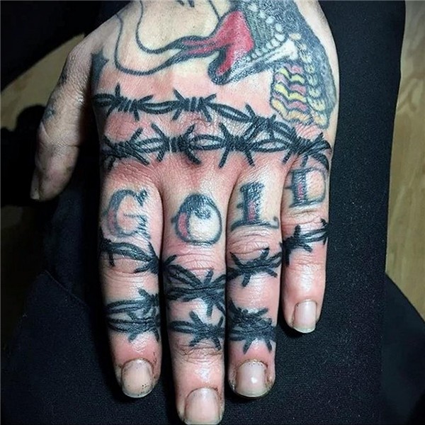 Barbed wire tattoo meaning: drawing history, features, photo