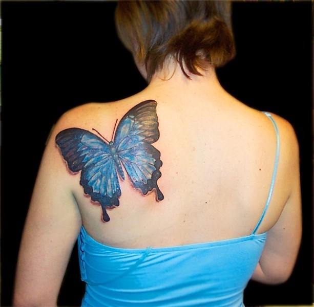 Black And Blue Ink Butterfly Tattoo On Left BAck SHoulder