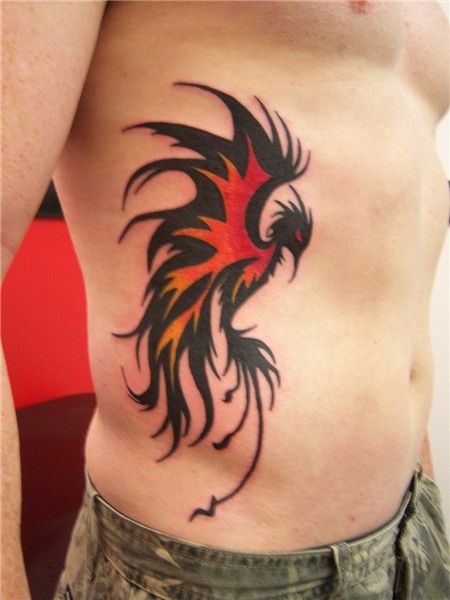 Black Tribal Flying Phoenix Tattoo On Man Side Rib