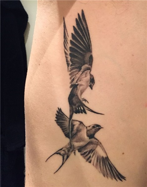 Black and grey realistic swallow tattoo