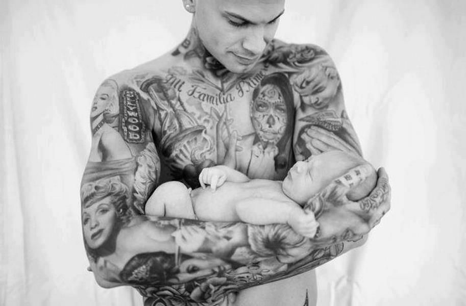 Black and white tattooed father with his newborn son Tattoos
