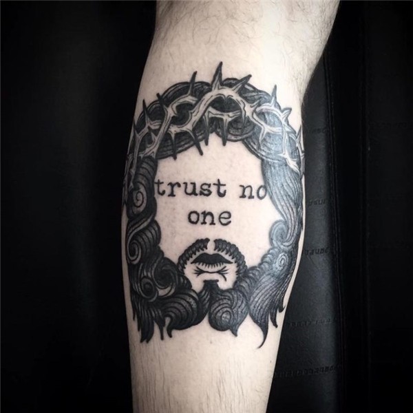 Black man trust no one tattoo on forearm