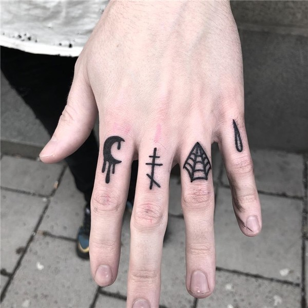 Black tattoos on fingers - Tattoogrid.net