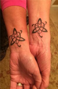 Sister Symbol Tattoo
