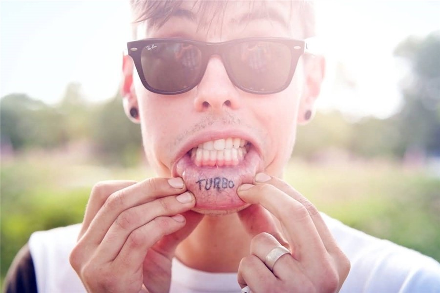 Cool Boy Shows His Lip Tattoo