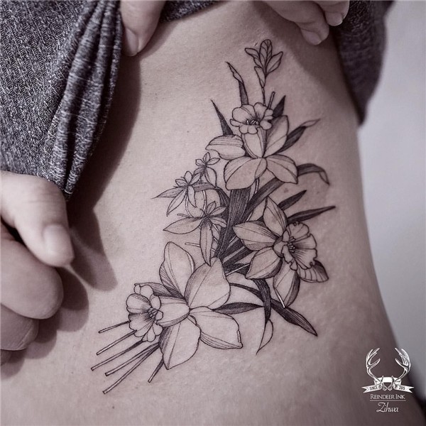 Daffodil black and white floral tattoo on the torso. - Reind