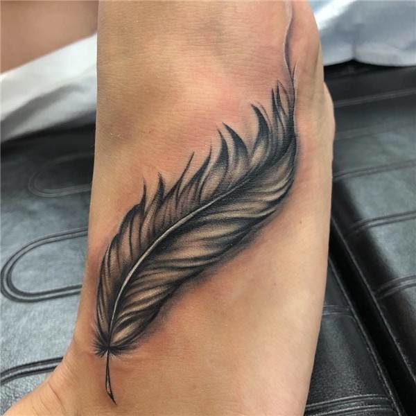 Defined Feather Tattoo This black-and-white feather tattoo i