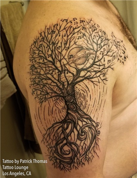 Fresh musical tree of life tattoo done by Patrick Thomas at
