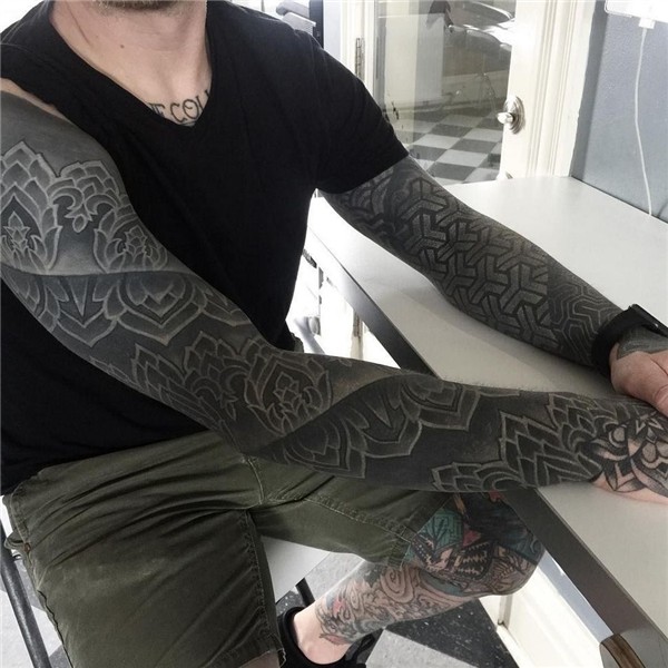 Full black sleeve tattoos - Back tattoos are primarily split