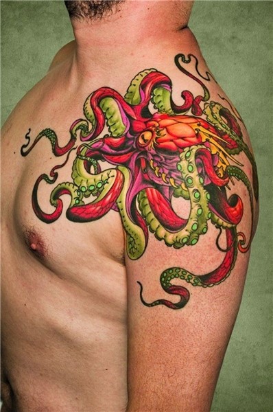 Gorgeous Octopus With Small Flower Tattoo On Shoulder