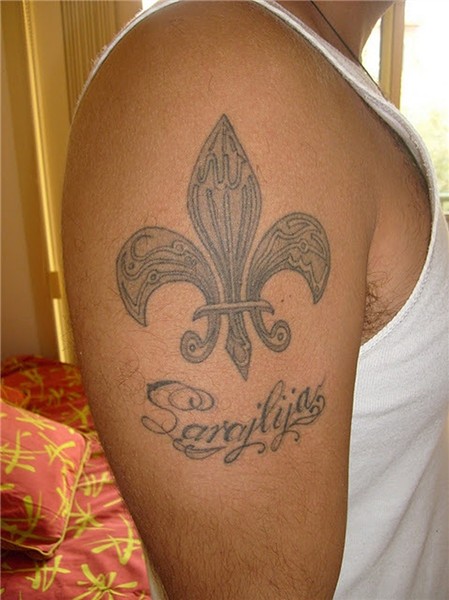 Grey ink fleur de lis tattoo on right shoulder - Tattoos Boo