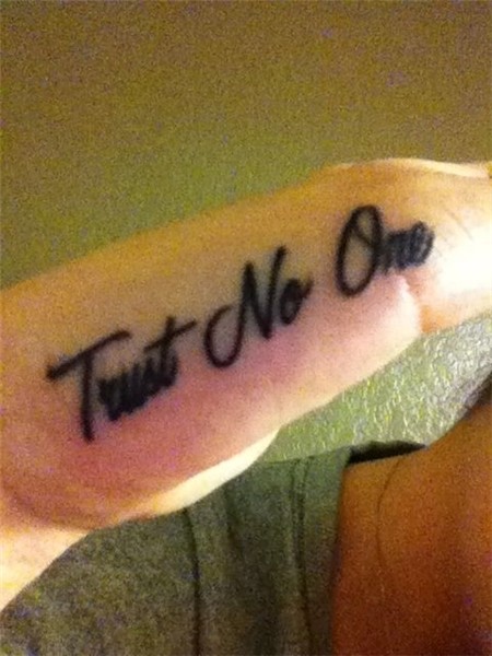 Hand tattoo trust no one Trust