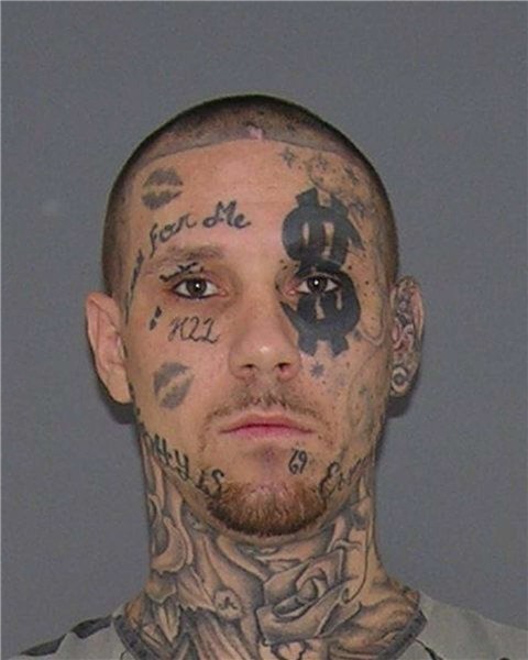 Man with dollar sign tattoo over his eye wanted for burglary