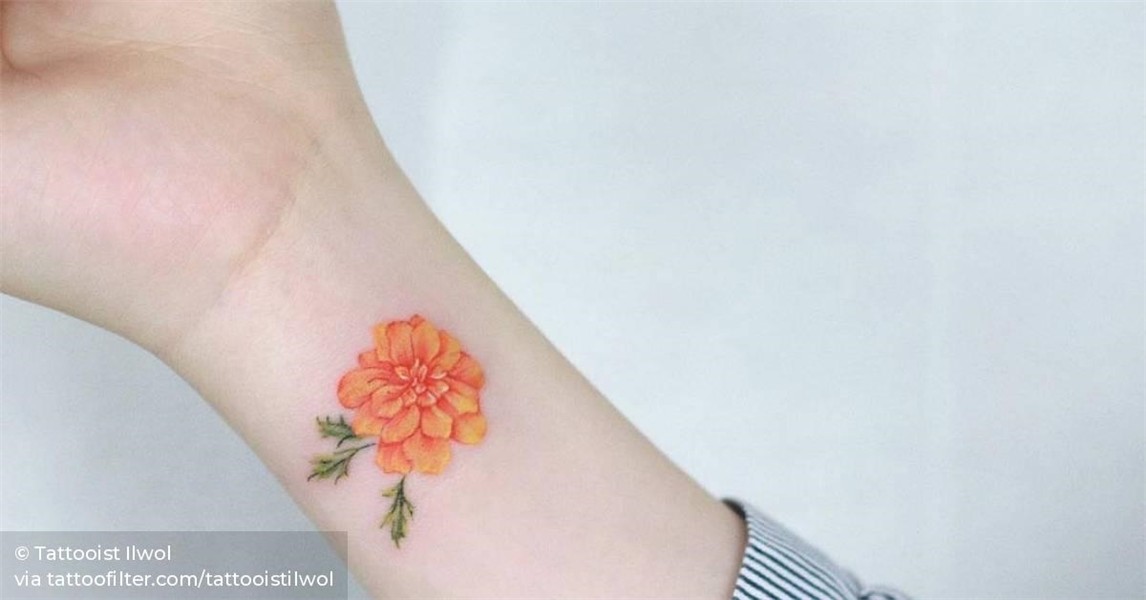 Marigold tattoo on the wrist.