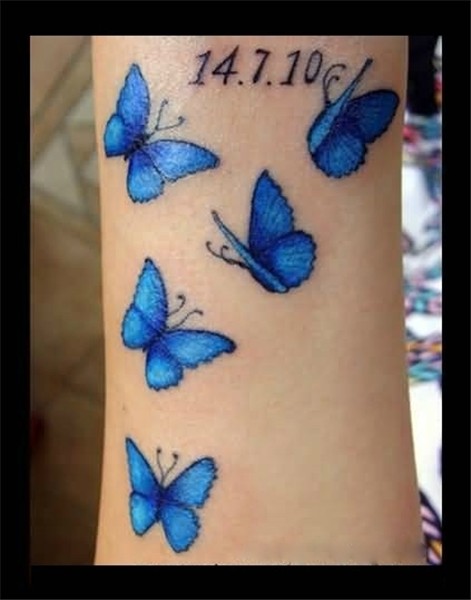 Memorable Blue Flying Butterfly Tattoo Made By Artist