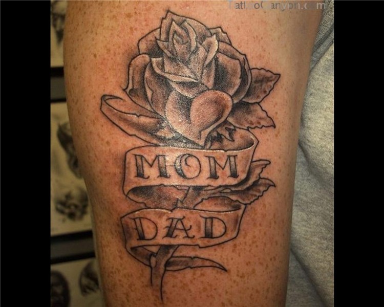 Mom Dad Banner And Rose Tattoo On Bicep