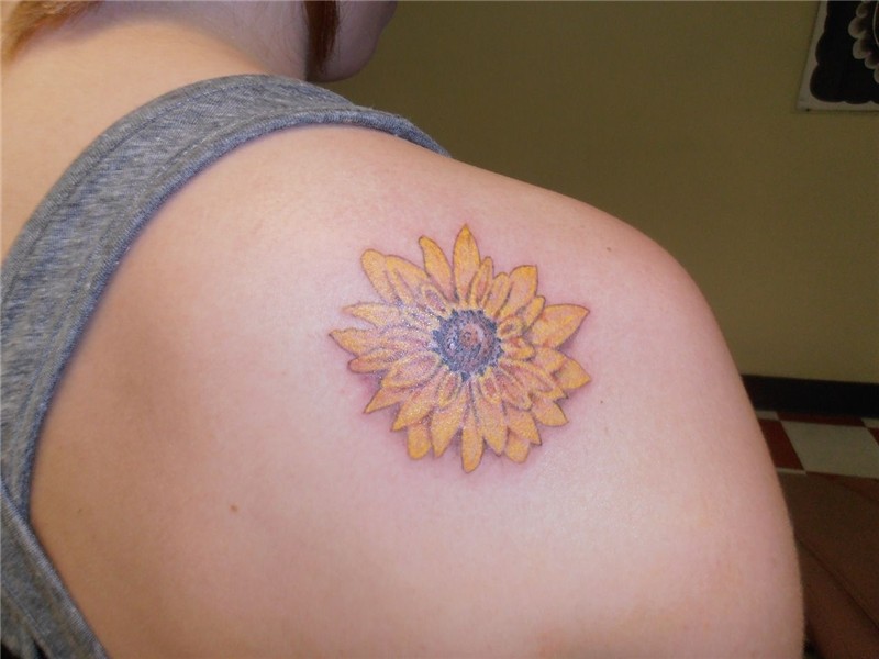 My flower tattoo on my right shoulder blade. ... in pink or