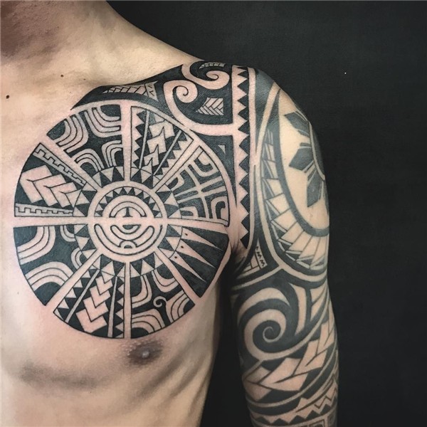 Polynesian chest tattoo addition to a half sleeve. Polynesia