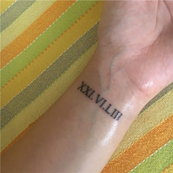 Roman numeral tattoo wrist Wrist tattoos for guys, Small wri