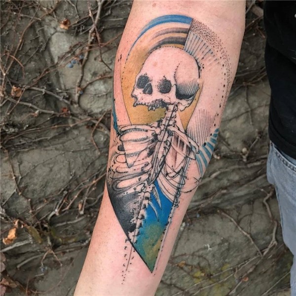 Skeleton tattoo on the right inner forearm.