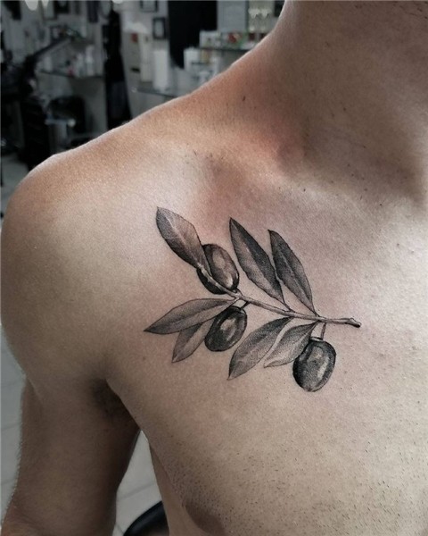 Super cool Olive Branch tattoo by Artist @luciantatar.tattoo