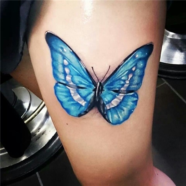 Thigh tattoo, full color butterfly done by Raphael Schilling