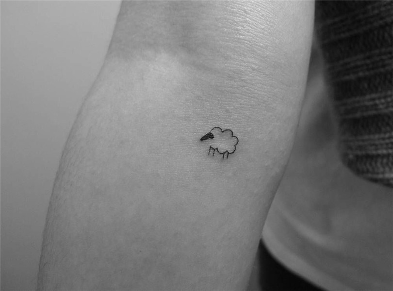 Tiny minimalist sheep tattoo on the inner forearm. Sheep tat