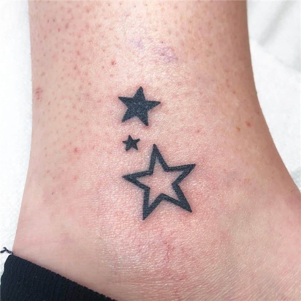 Tiny star tattoo
