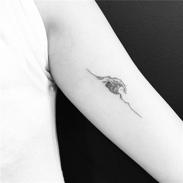 Wave tattoo on the left inner arm. Tattoo artist: Evan Kim #