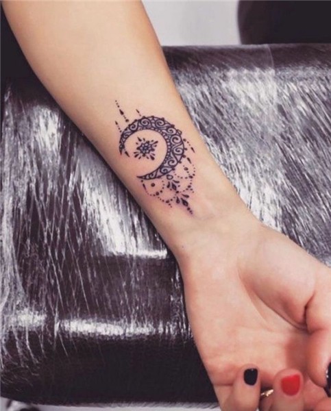 moon tattoo on the wrist, red and black nail polish, female