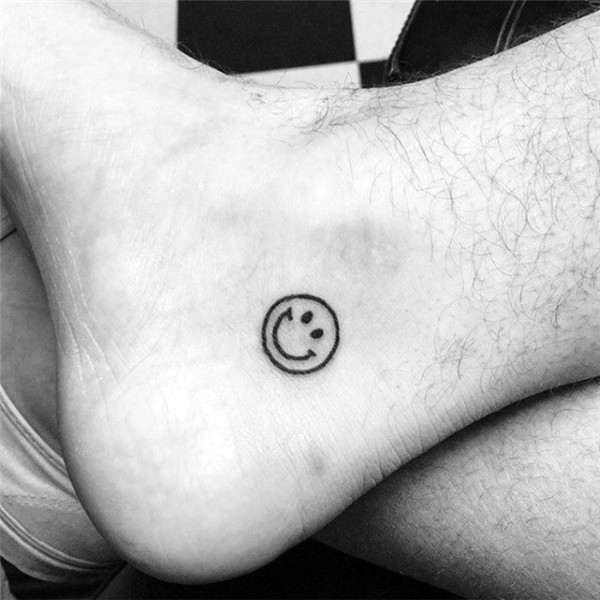 smiley-face-tattoo-very-simple-design-done-in-black-near-a-m